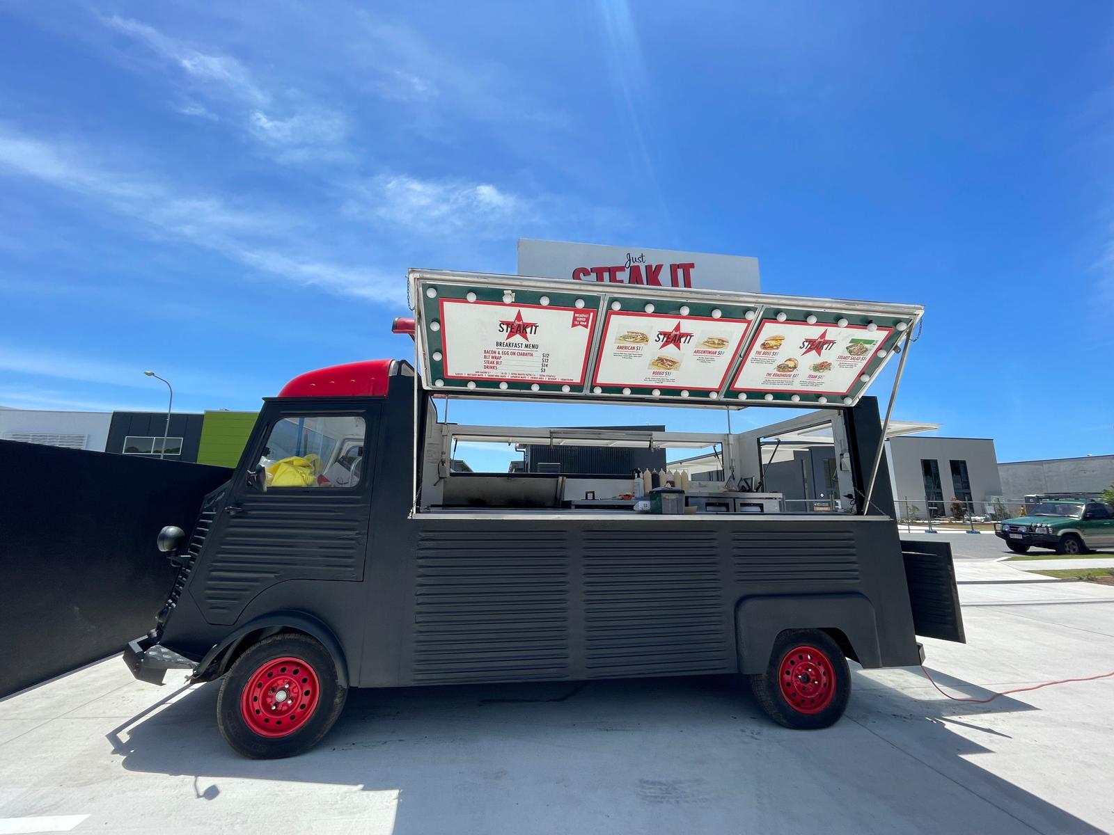 The Just Steak It food truck with its serving hatch open